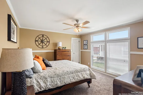 a bedroom with a large bed and a couch