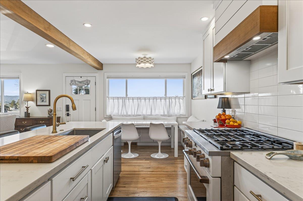 1232 Vallejo Street Seaside, CA 93955 - Photo 19 of 42 a kitchen that has a lot of cabinets in it