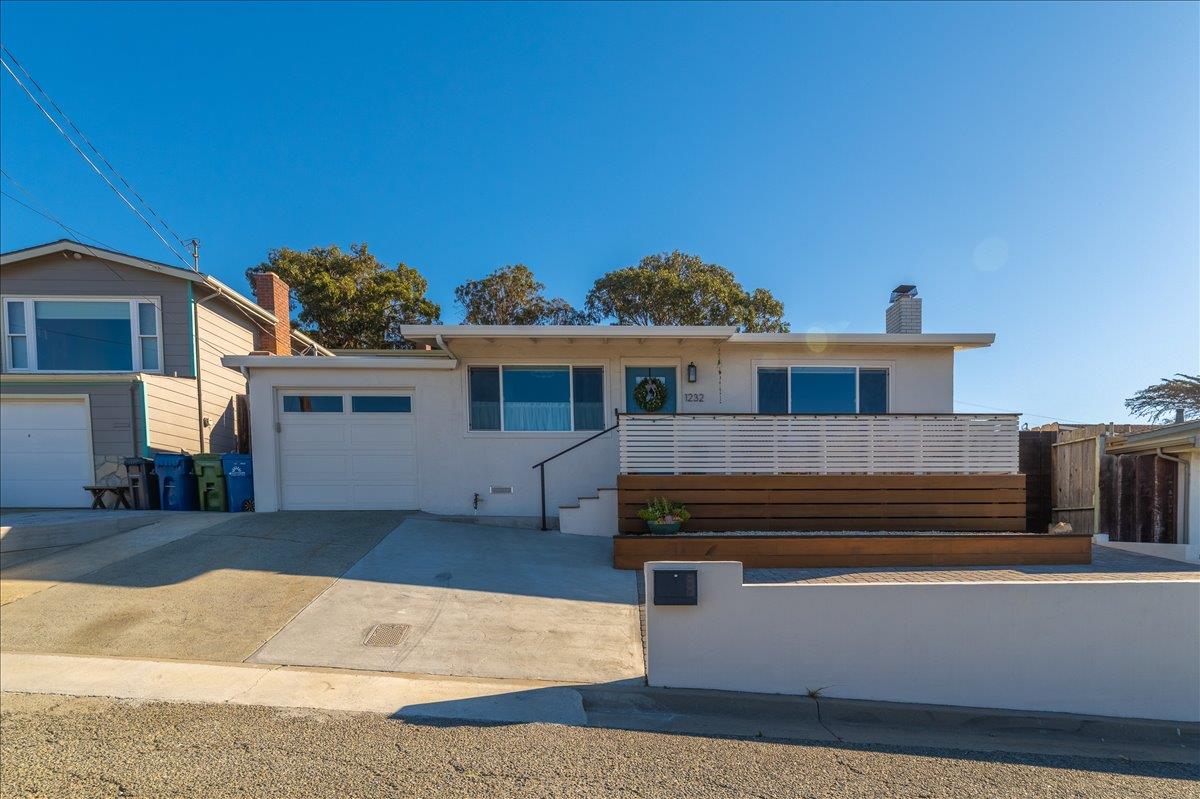 1232 Vallejo Street Seaside, CA 93955 - Photo 2 of 42 a front view of a house with a yard