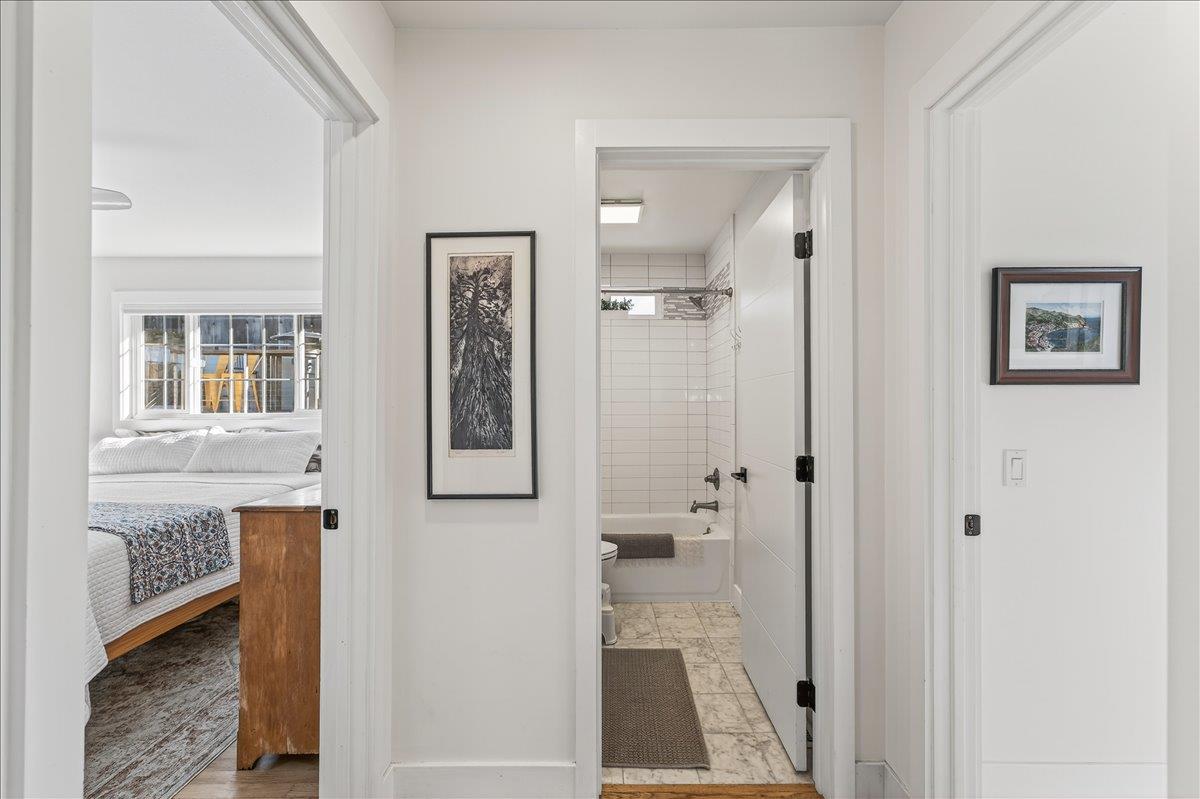 1232 Vallejo Street Seaside, CA 93955 - Photo 29 of 42 a bathroom with a granite countertop shower mirror and a sink