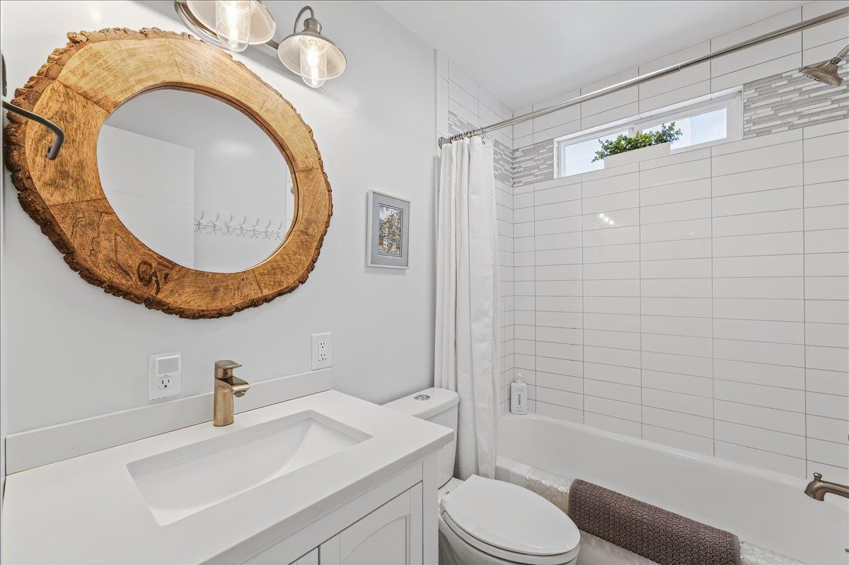 1232 Vallejo Street Seaside, CA 93955 - Photo 33 of 42 a bathroom with a sink a toilet and a mirror