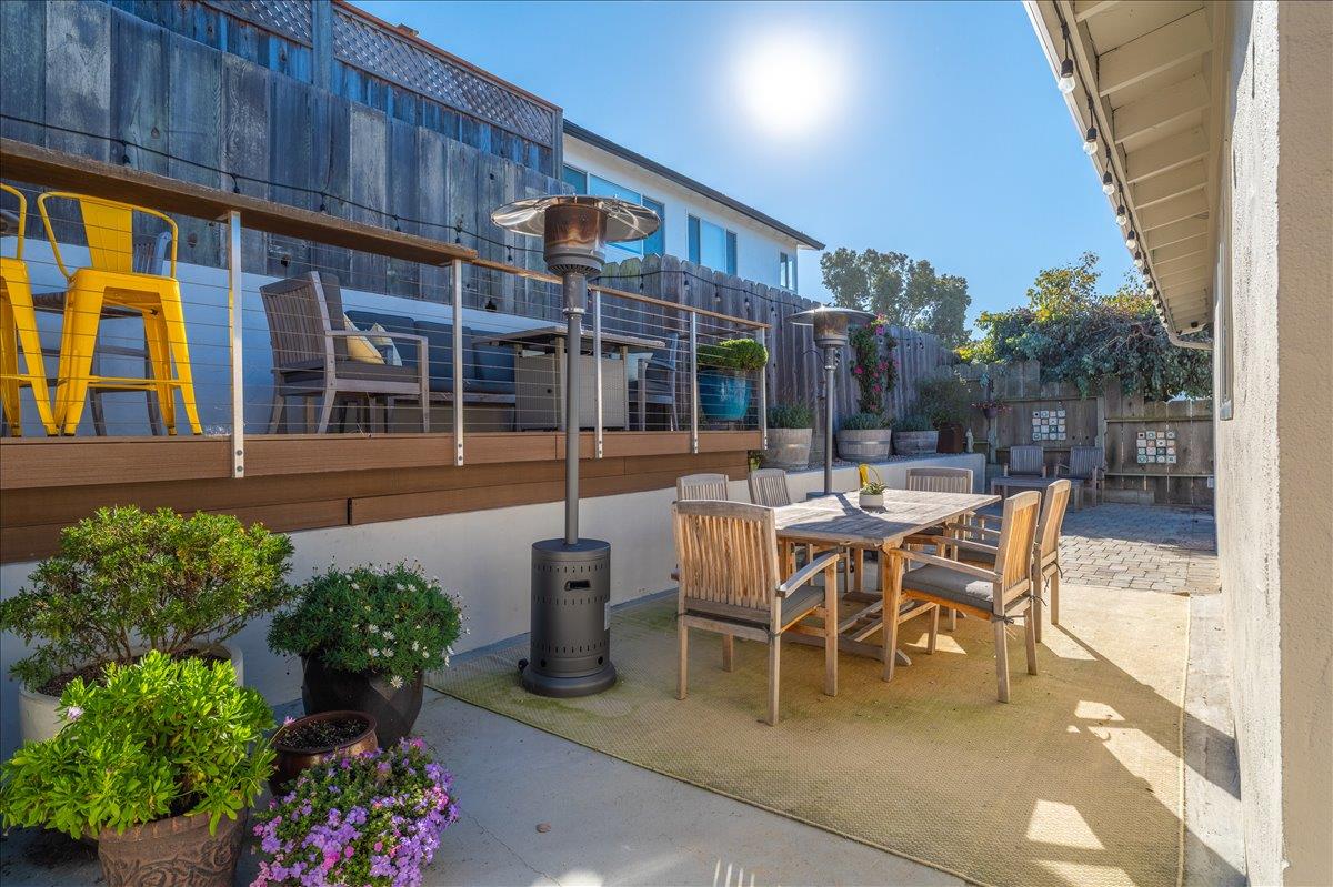 1232 Vallejo Street Seaside, CA 93955 - Photo 37 of 42 a patio with table and chairs and potted plants