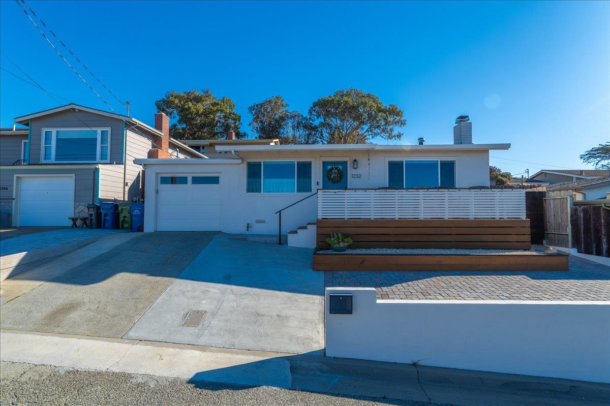 1232 Vallejo Street Seaside, CA 93955 - Photo 5 of 42 a view of a house with a wooden fence