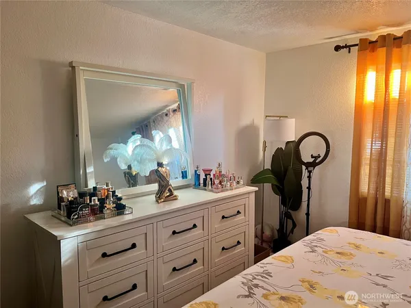 a bathroom with a double vanity sink mirror and toilet