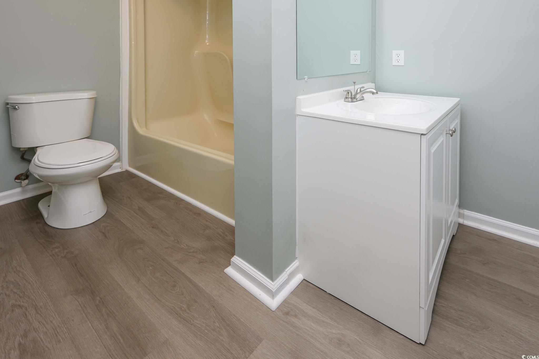 1841 Fairway Ridge Drive, Unit 5H Myrtle Beach, SC 29575 - Photo 17 of 22 Full bathroom featuring vanity, wood-type flooring