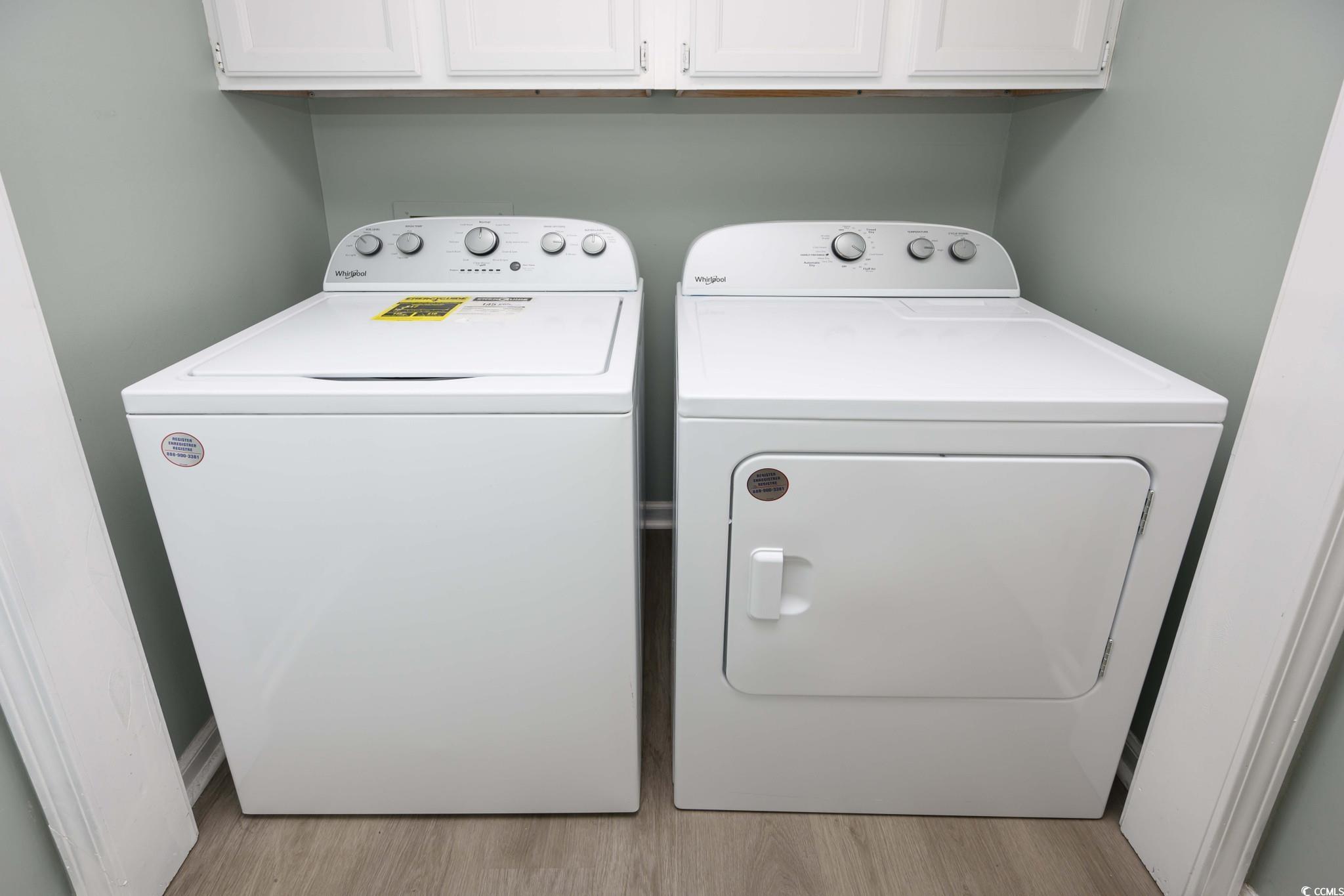 1841 Fairway Ridge Drive, Unit 5H Myrtle Beach, SC 29575 - Photo 19 of 22 Washroom featuring cabinets, separate washer and d