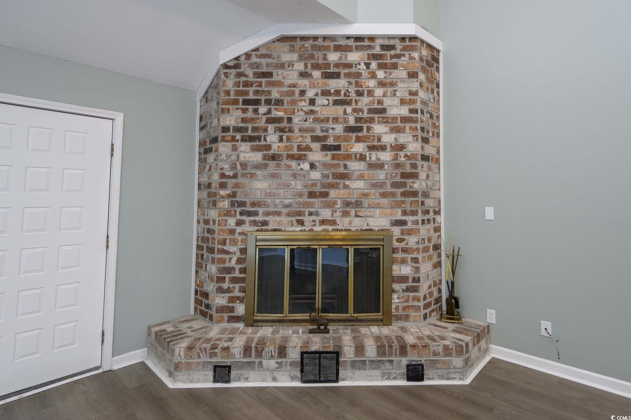 1841 Fairway Ridge Drive, Unit 5H Myrtle Beach, SC 29575 - Photo 8 of 22 Unfurnished living room featuring vaulted ceiling,