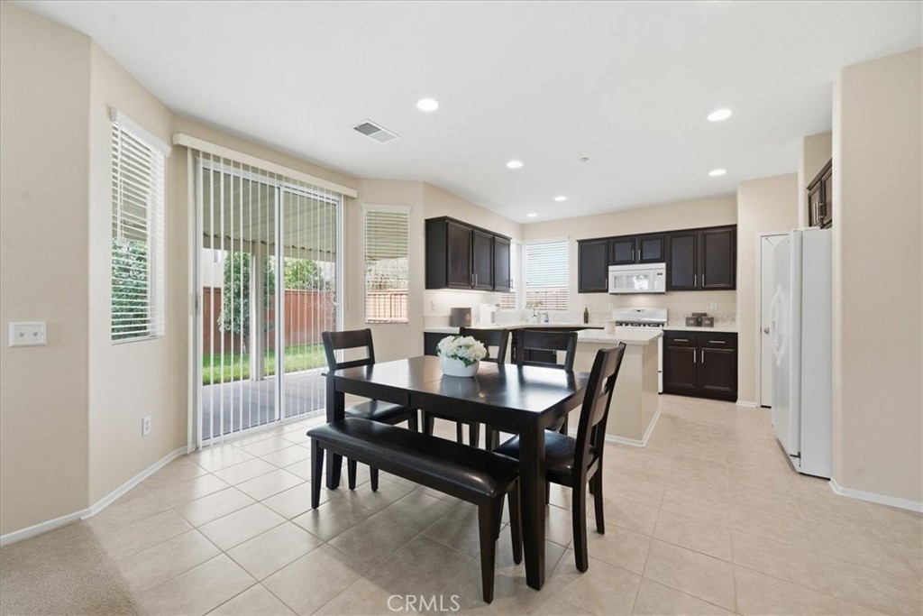 4674 Trailmore Court Riverside, CA 92505 - Photo 11 of 45 a view of a dining room with furniture window and outside view