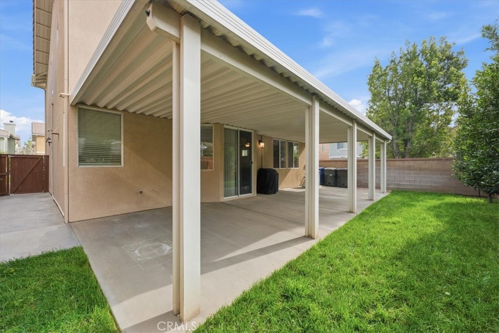 4674 Trailmore Court Riverside, CA 92505 - Photo 34 of 45 a view of house with backyard