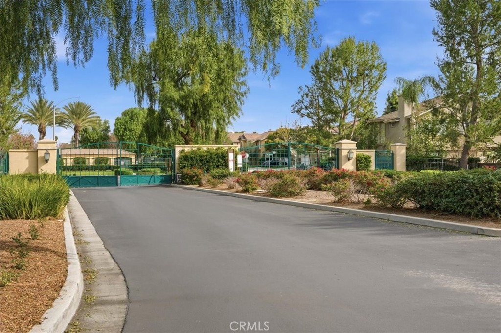 4674 Trailmore Court Riverside, CA 92505 - Photo 44 of 45 front view of a house with a yard and potted plants