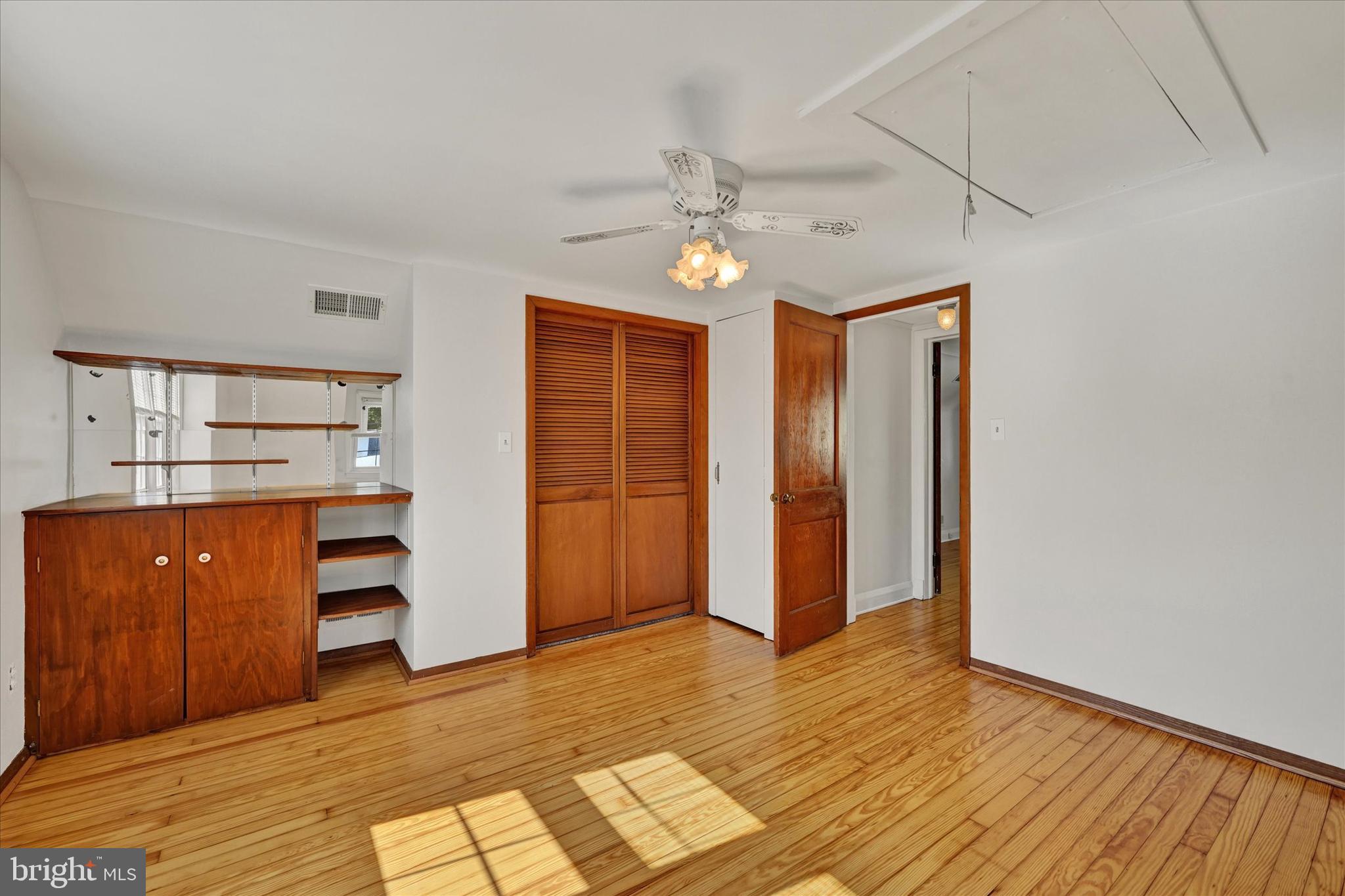 4415 Raspe Avenue Baltimore, MD 21206 - Photo 19 of 28 Bedroom 3 with Built-ins & Ceiling Fan