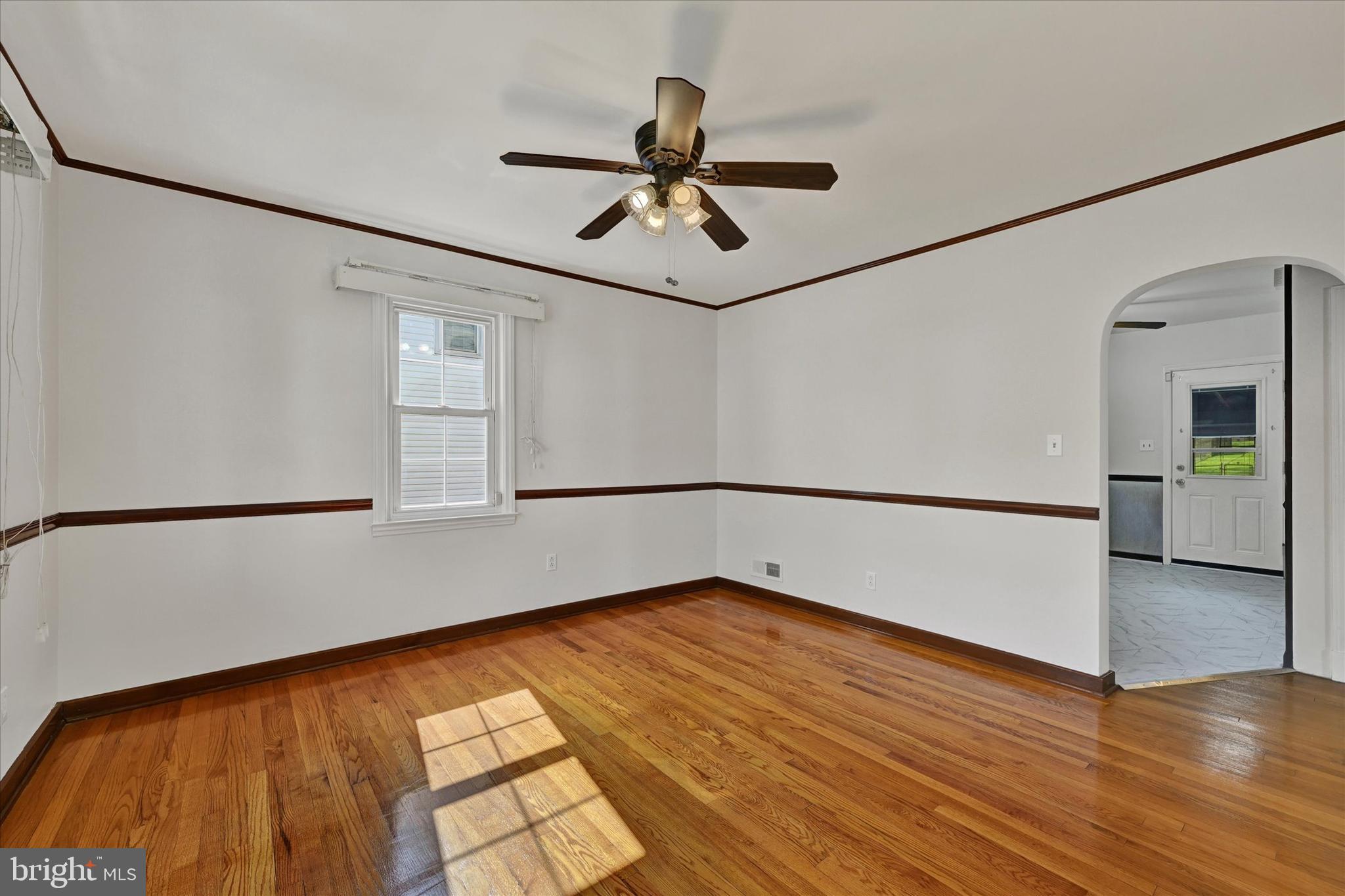 4415 Raspe Avenue Baltimore, MD 21206 - Photo 5 of 28 Dining Room with Chair Railing & Molding