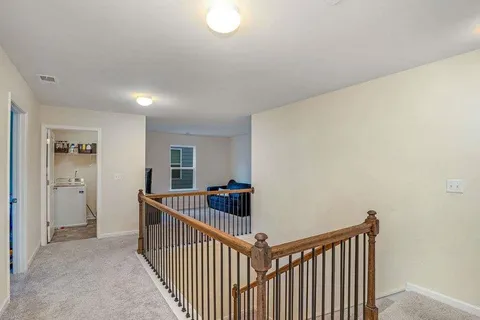 a view of hallway with livingroom