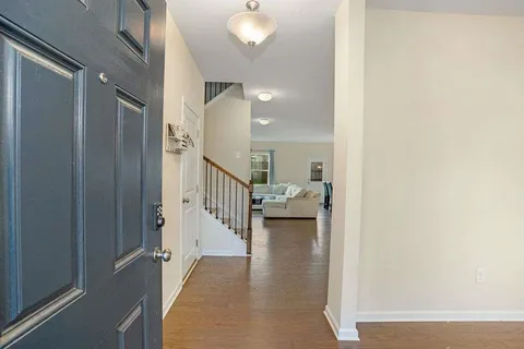 a view of a hallway with a dining room