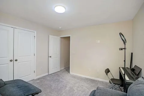 a view of room with furniture and a rug