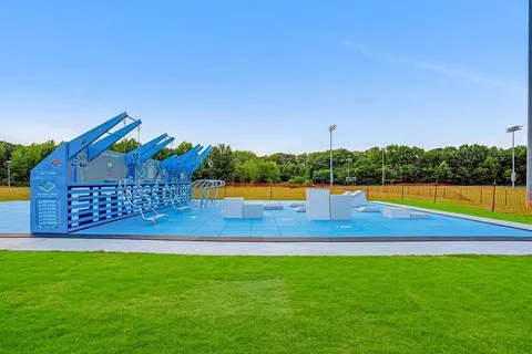 a view of a park with large trees