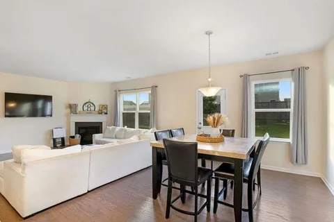 a view of a dining room with furniture window and outside view