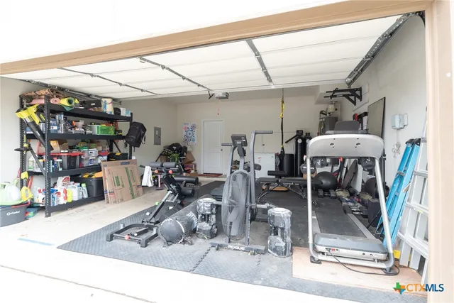 a room with lots of gym equipment