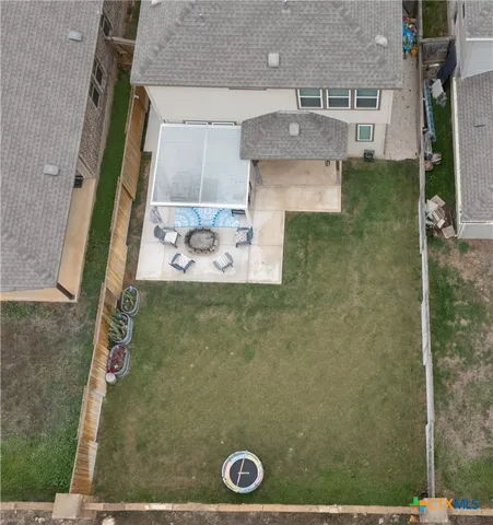 an aerial view of a house with swimming pool
