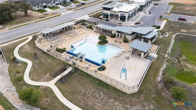 an aerial view of a house with a swimming pool