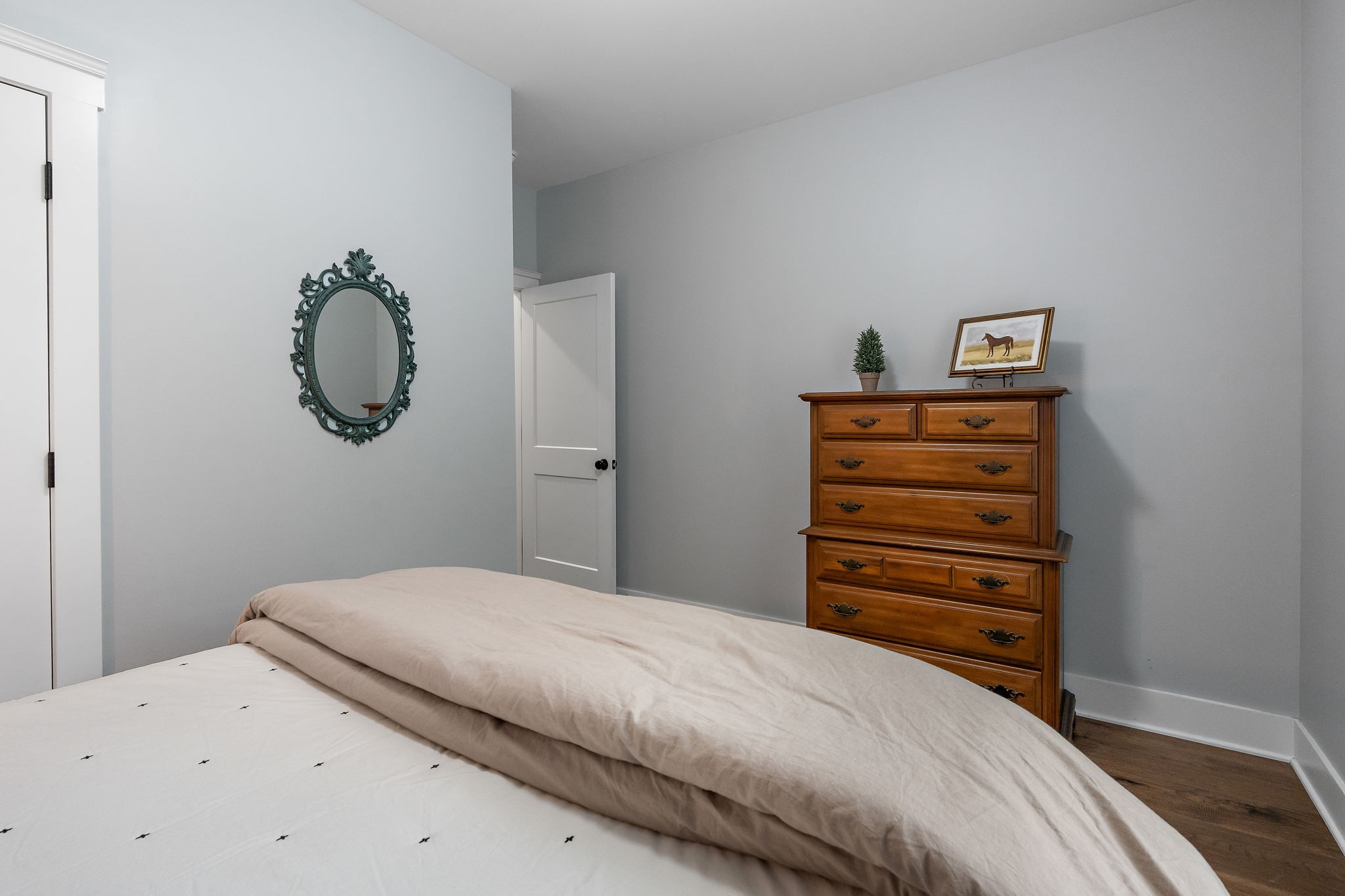 2379 White Bluff Road Burns, TN 37029 - Photo 21 of 40 a bedroom with a bed and cabinets