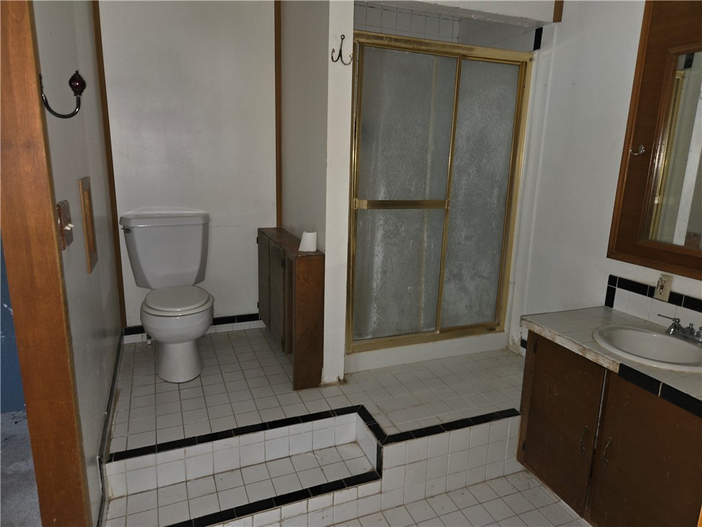 305 East Laredo Street Freer, TX 78357 - Photo 13 of 19 a bathroom with a sink and toilet