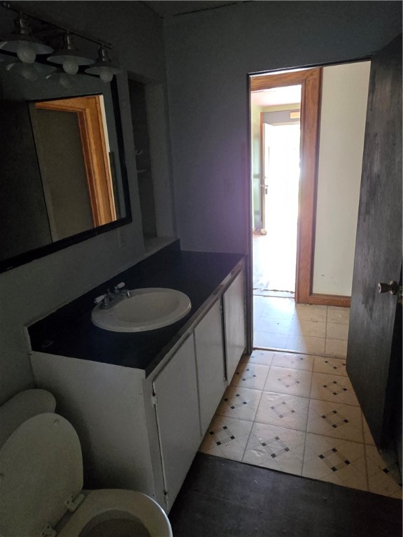 305 East Laredo Street Freer, TX 78357 - Photo 17 of 19 a bathroom with a sink and a mirror