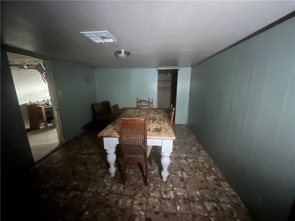 305 East Laredo Street Freer, TX 78357 - Photo 7 of 19 a view of a hallway to room with wooden floor