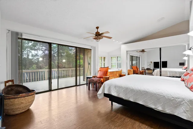 a bed room with a bed and glass chair