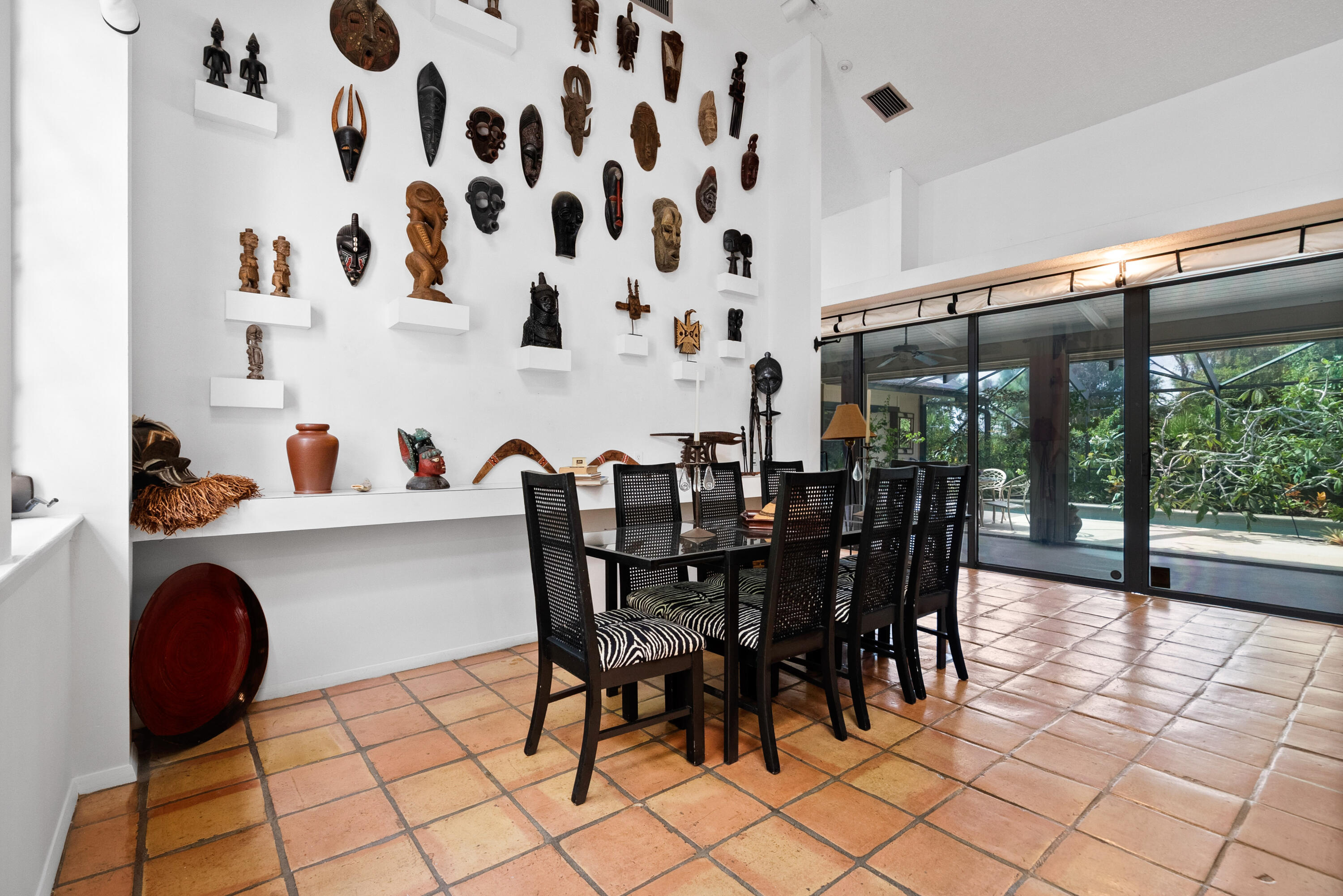 3217 Northwest Perimeter Road Palm City, FL 34990 - Photo 19 of 64 a dining room with furniture and a floor to ceiling window