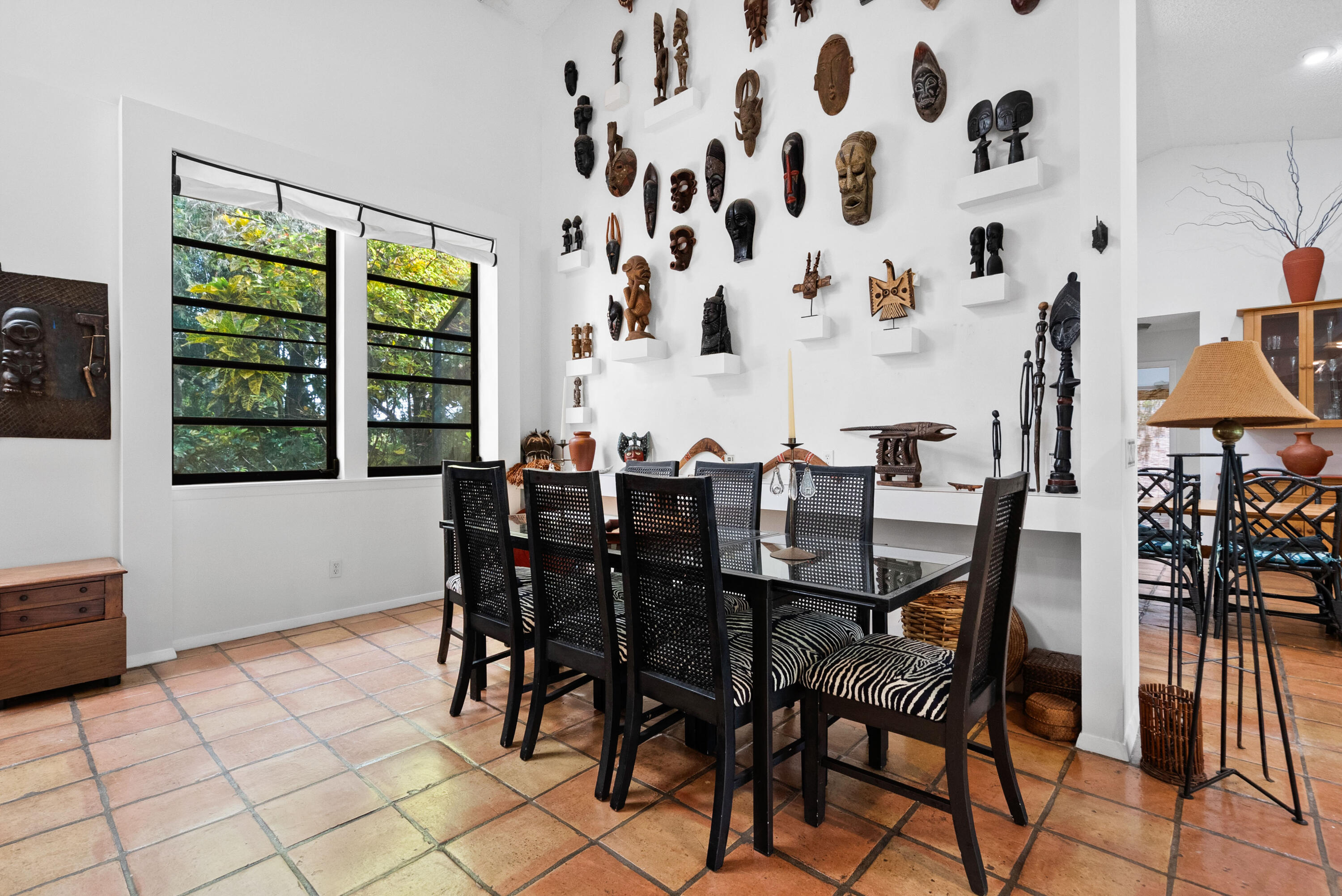 3217 Northwest Perimeter Road Palm City, FL 34990 - Photo 25 of 64 a view of a dining room with furniture and chandelier