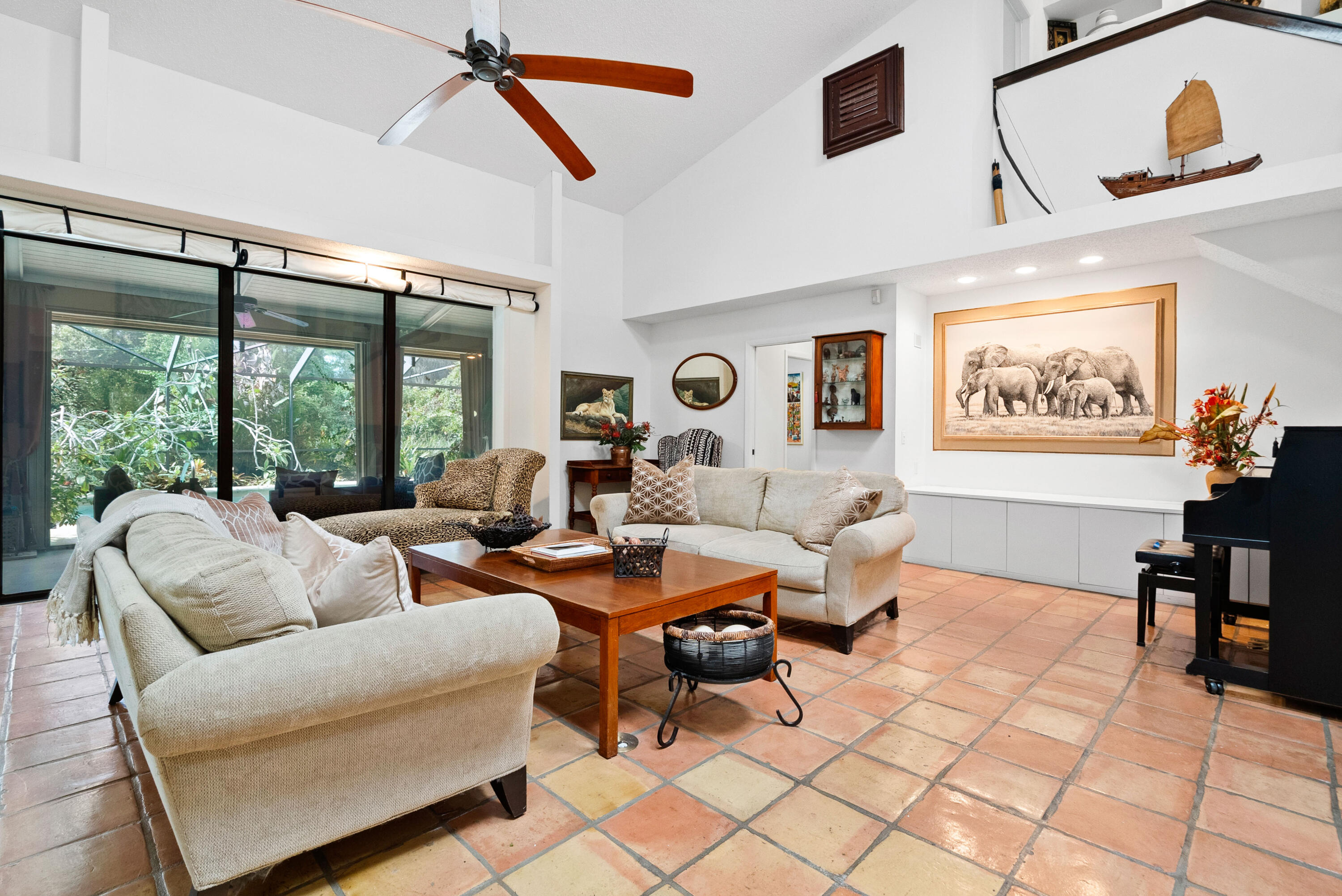 3217 Northwest Perimeter Road Palm City, FL 34990 - Photo 26 of 64 a living room with furniture and a floor to ceiling window