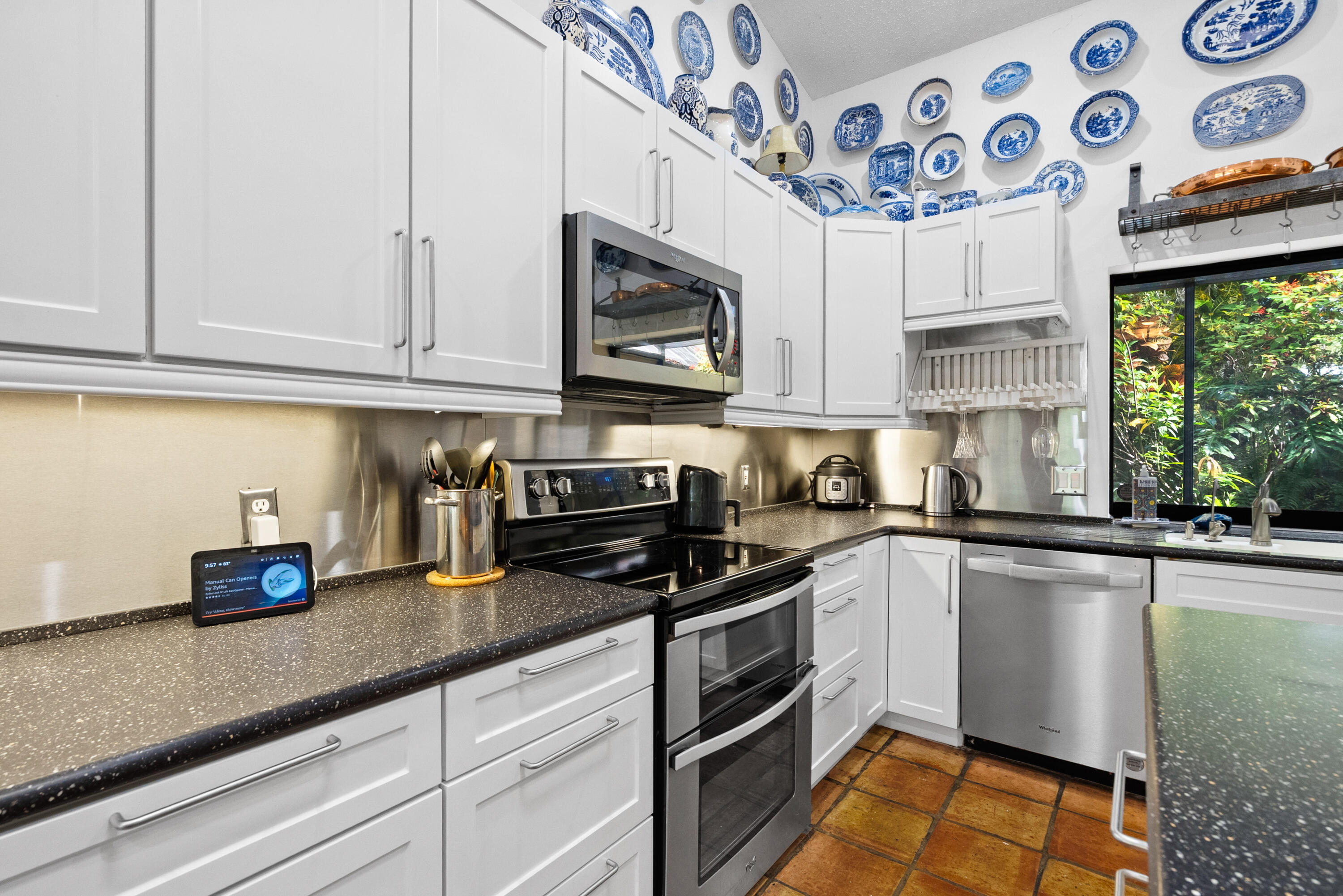 3217 Northwest Perimeter Road Palm City, FL 34990 - Photo 3 of 64 a kitchen with stainless steel appliances granite countertop a sink a stove and cabinets