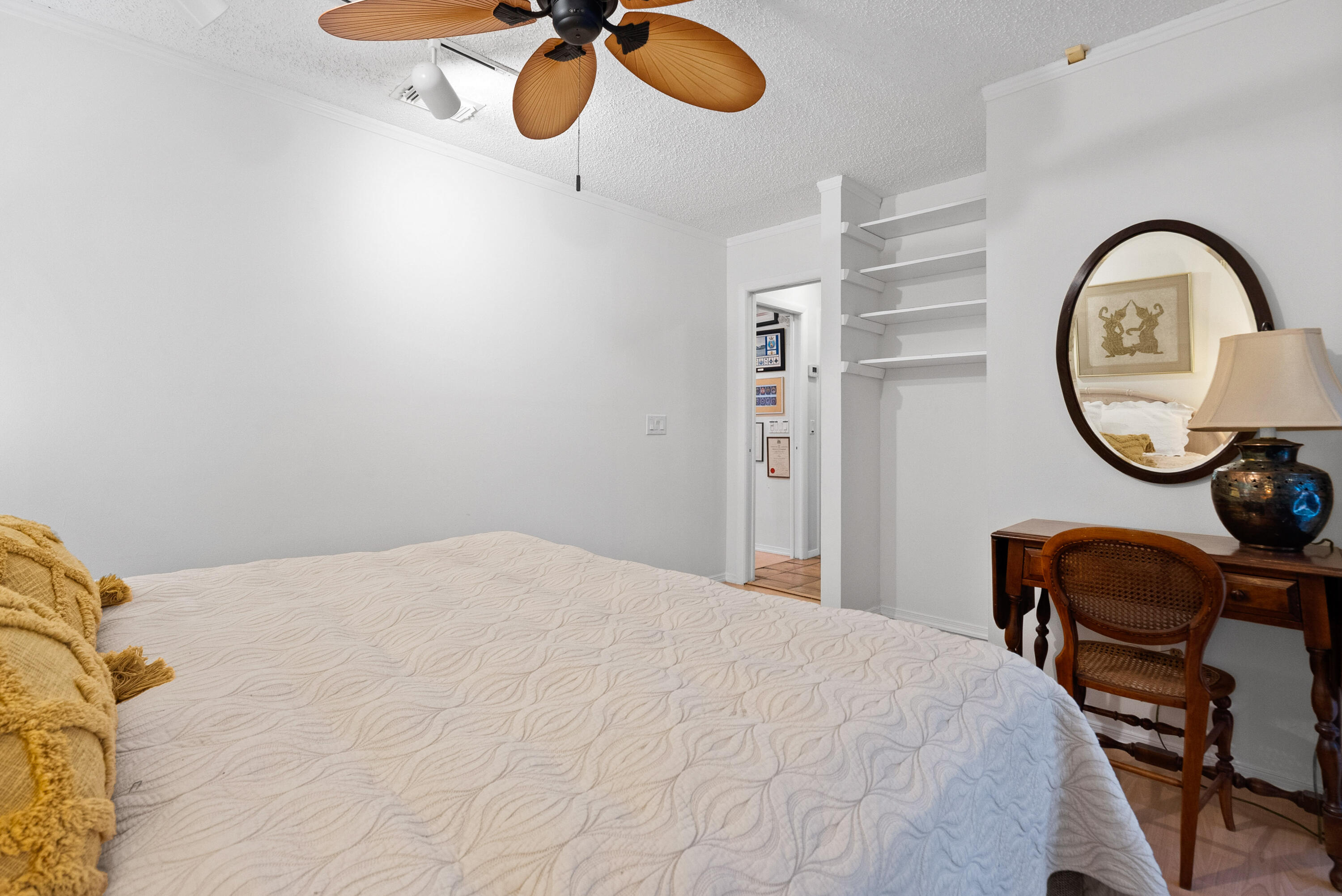 3217 Northwest Perimeter Road Palm City, FL 34990 - Photo 44 of 64 a bedroom with a bed and a chandelier