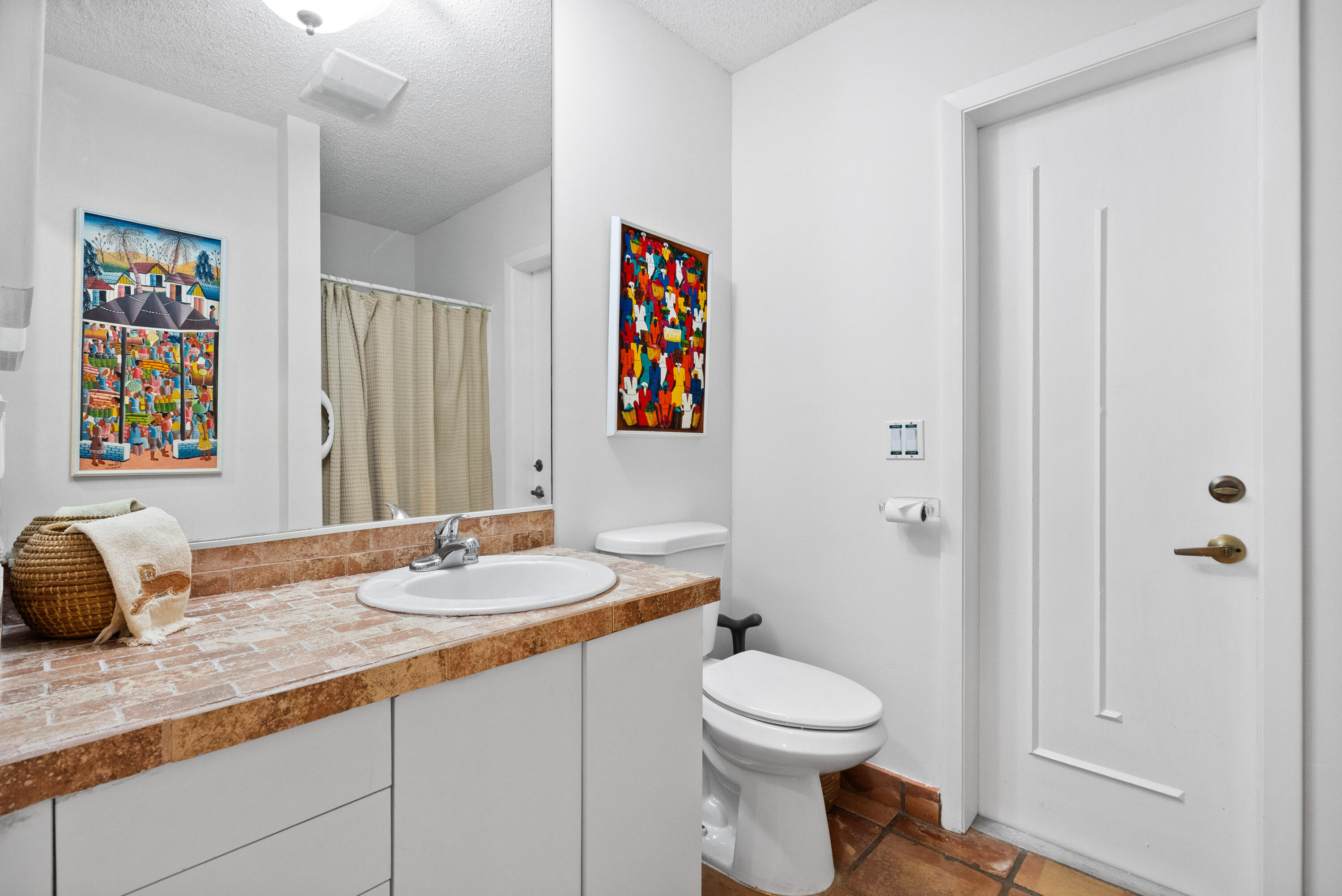 3217 Northwest Perimeter Road Palm City, FL 34990 - Photo 45 of 64 a bathroom with a granite countertop sink mirror vanity and toilet