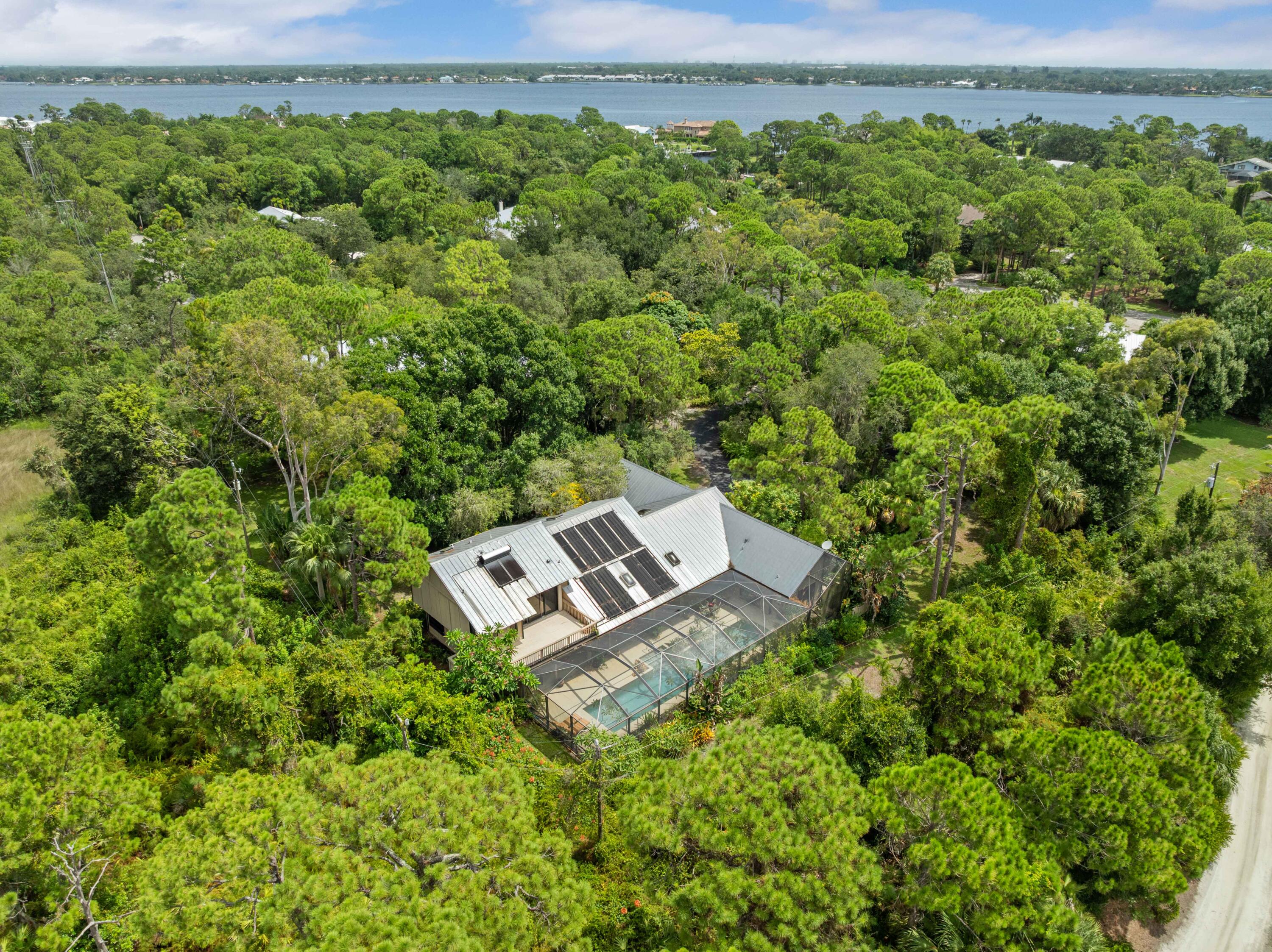3217 Northwest Perimeter Road Palm City, FL 34990 - Photo 54 of 64 an aerial view of a house with a yard