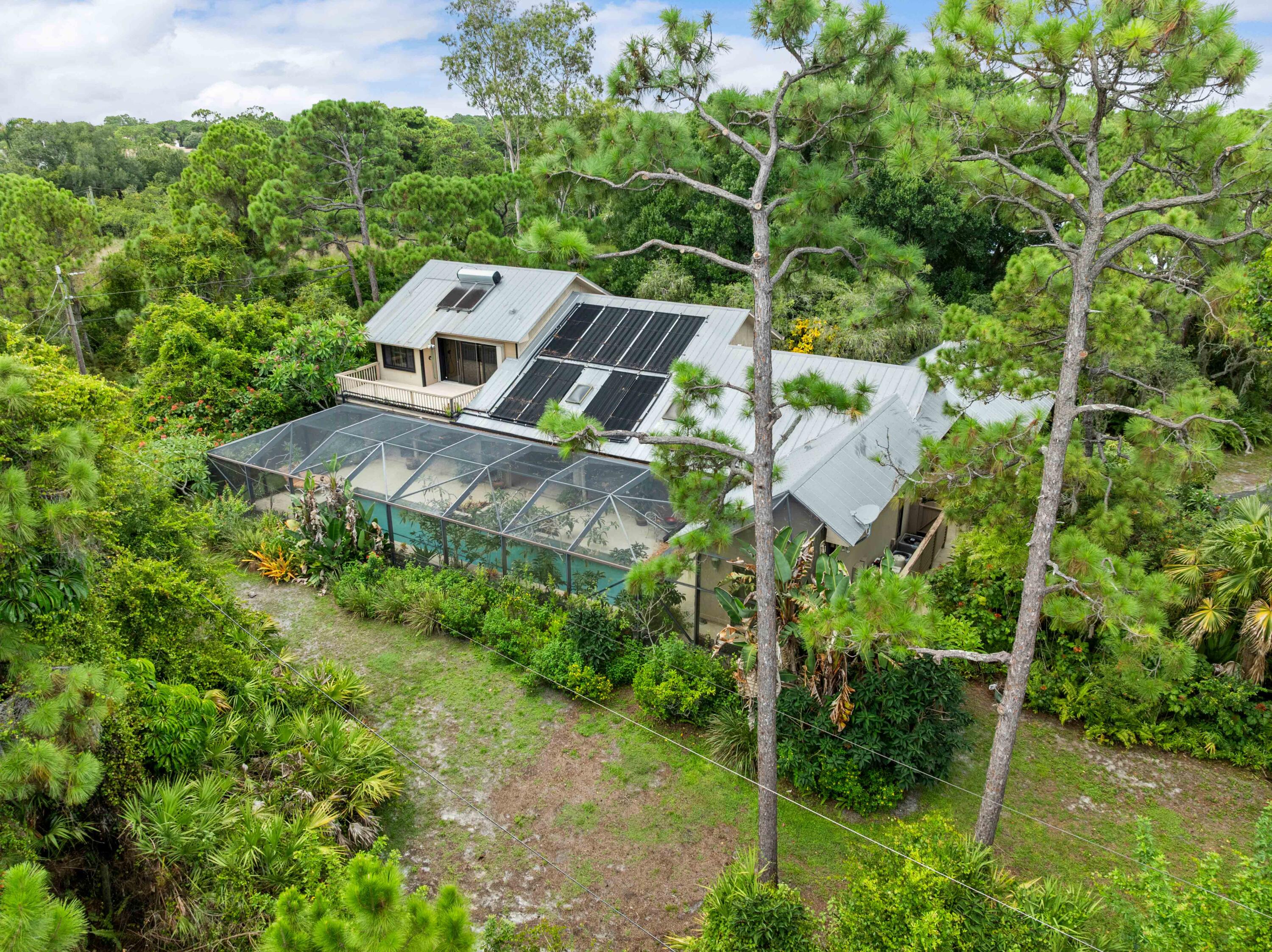 3217 Northwest Perimeter Road Palm City, FL 34990 - Photo 57 of 64 an aerial view of a house with a yard