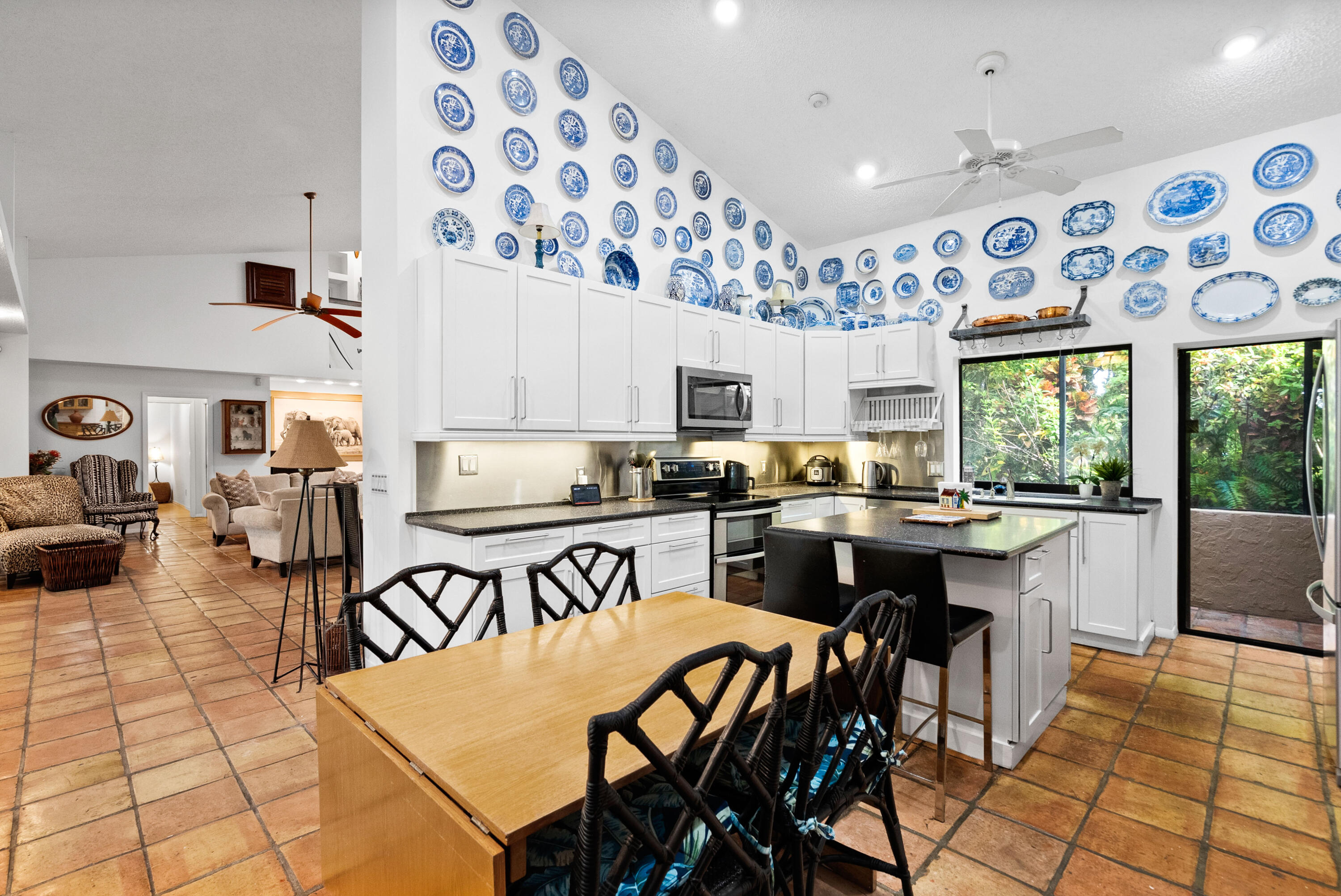 3217 Northwest Perimeter Road Palm City, FL 34990 - Photo 6 of 64 a kitchen with stainless steel appliances granite countertop a stove a sink and a refrigerator