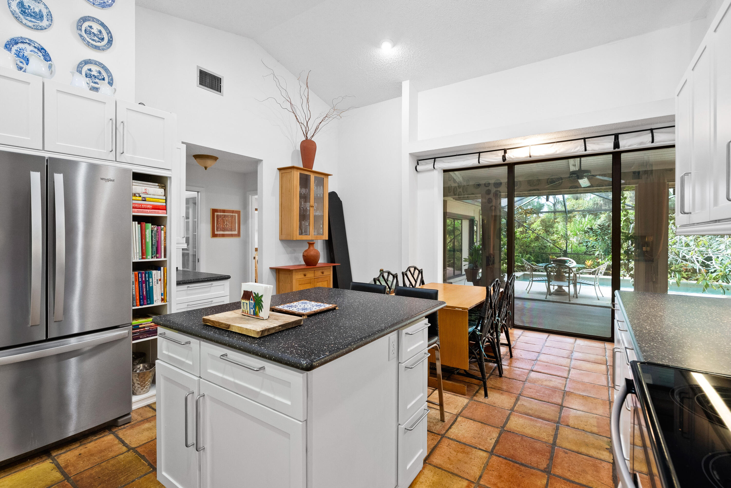 3217 Northwest Perimeter Road Palm City, FL 34990 - Photo 9 of 64 a kitchen with stainless steel appliances granite countertop a refrigerator and a stove
