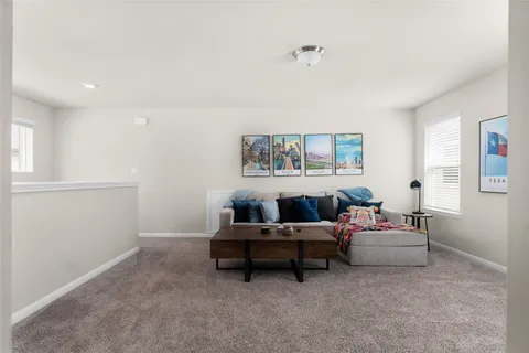 a bedroom with a bed and a chair