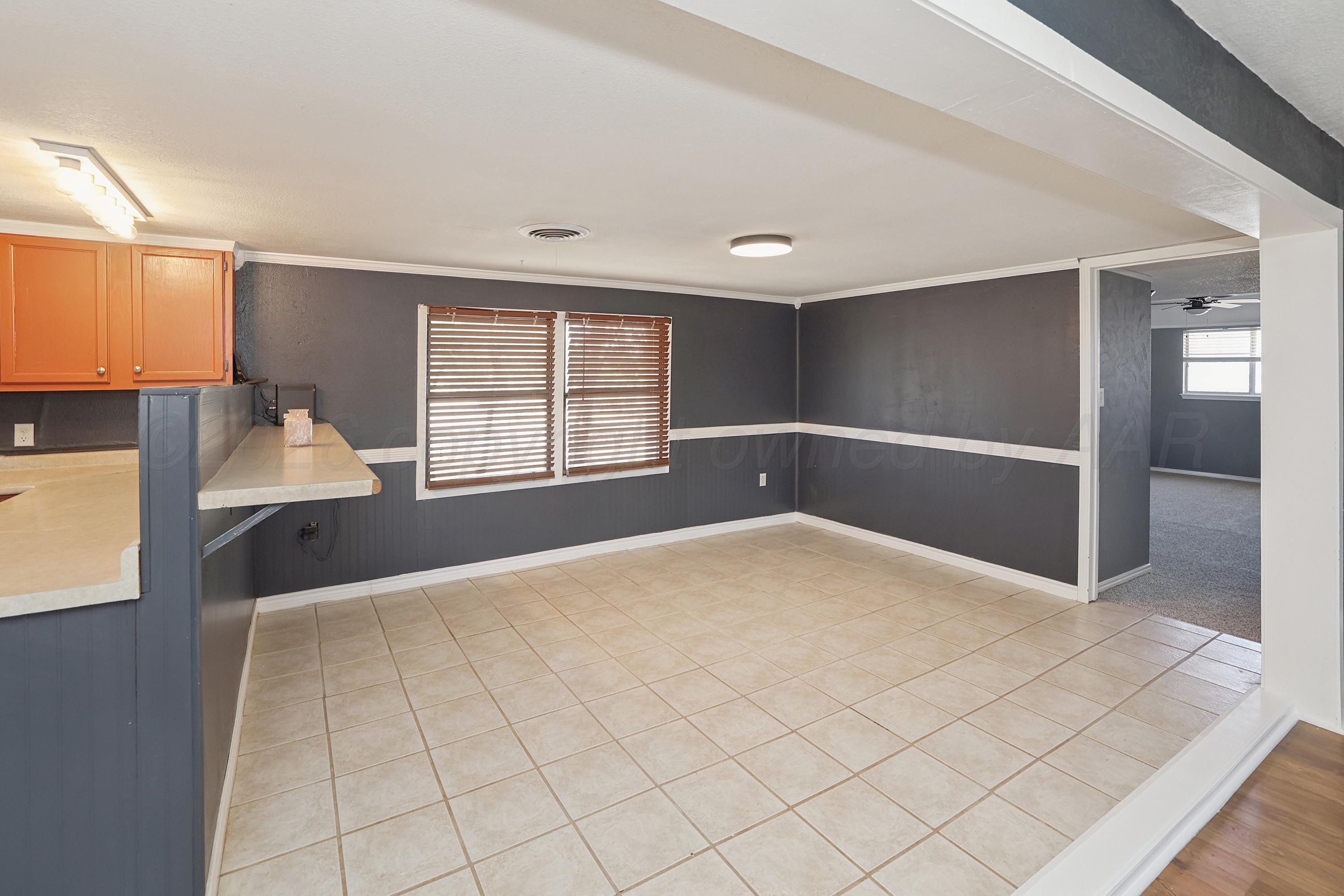 14200 Savannah Road Amarillo, TX 79118 - Photo 6 of 34 a view of an empty room with a window