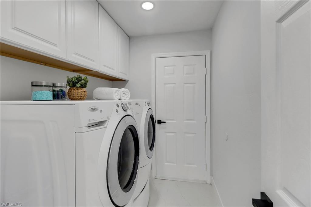 172 Plantation Circle Naples, FL 34104 - Photo 20 of 36 a utility room with dryer and washer