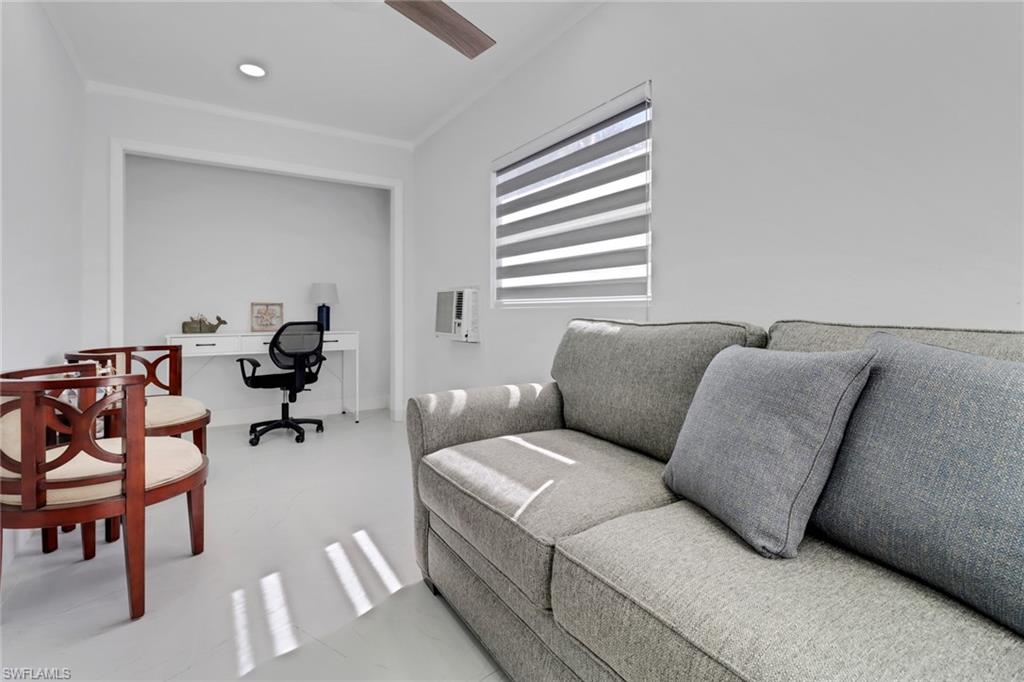 172 Plantation Circle Naples, FL 34104 - Photo 26 of 36 a living room with furniture and a window