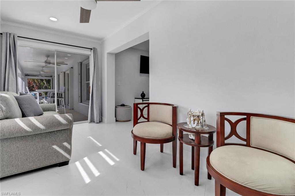 172 Plantation Circle Naples, FL 34104 - Photo 27 of 36 a living room with furniture and a potted plant