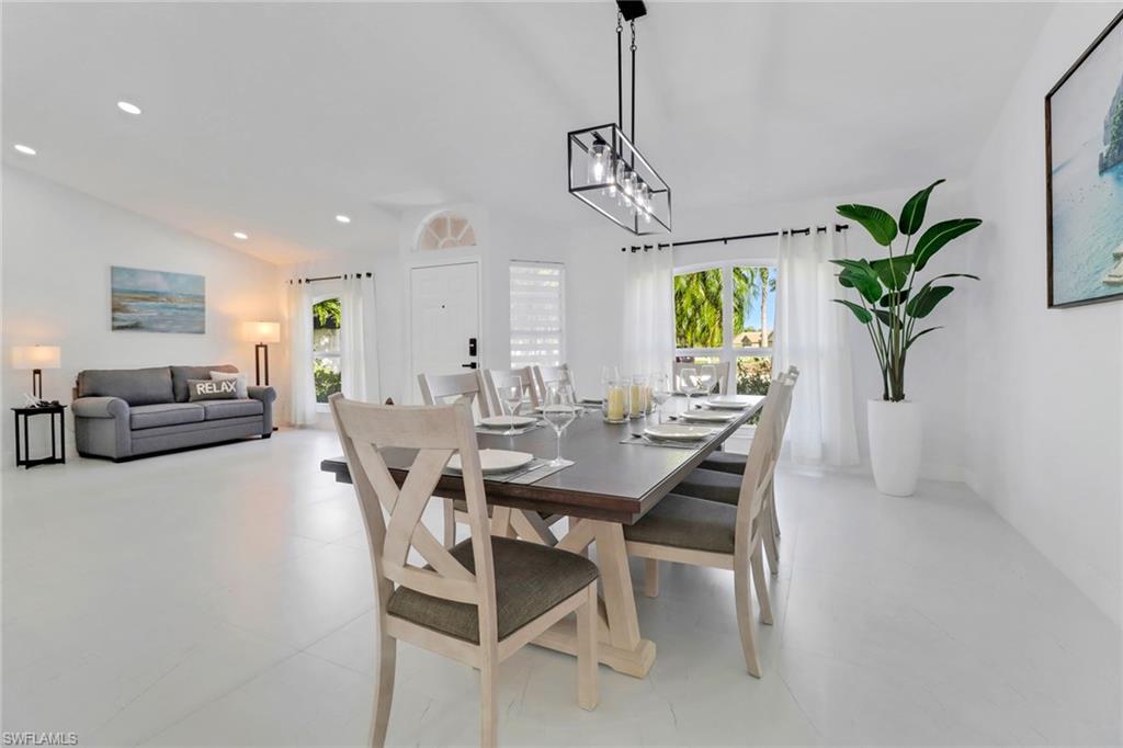 172 Plantation Circle Naples, FL 34104 - Photo 30 of 36 a view of a dining room with furniture window and flowerpot