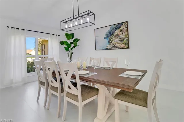 a view of a dining room with furniture window and flowerpot