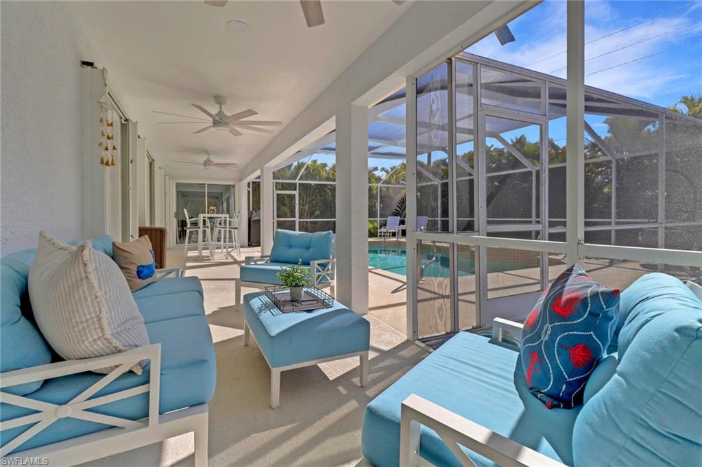 172 Plantation Circle Naples, FL 34104 - Photo 33 of 36 a living room with furniture and a large window