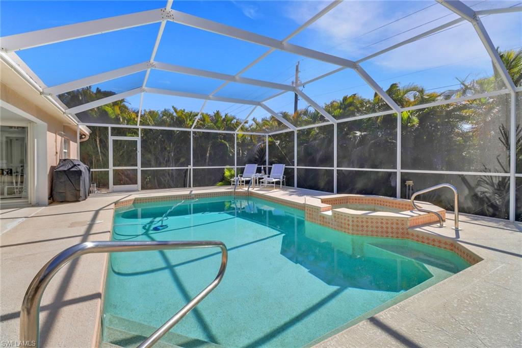 172 Plantation Circle Naples, FL 34104 - Photo 34 of 36 a view of a backyard with swimming pool