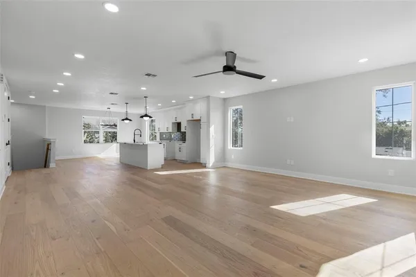 a view of an empty room and a window