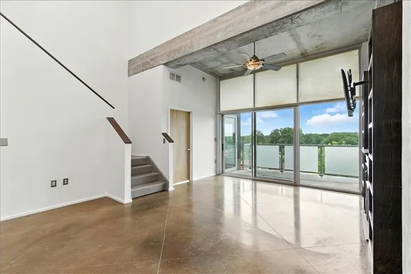 a view of an entryway with wooden floor